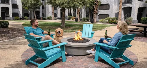 Fire pit with couple and dog