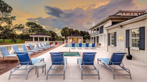 pool and apartment building at dusk