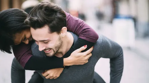 woman piggyback riding man
