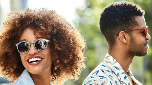 woman and man smiling and posing outside