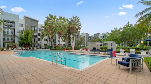 View of pool with community in background