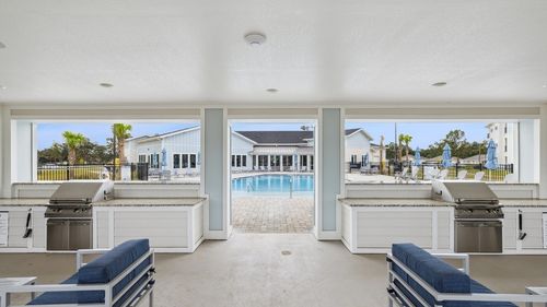 Ascend at Woodlands outdoor space with pool and grills