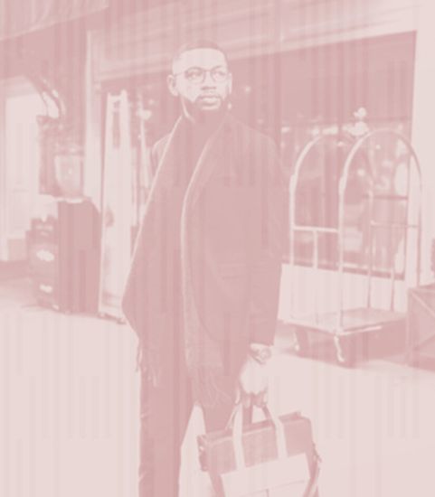 man outside hotel looking to the side