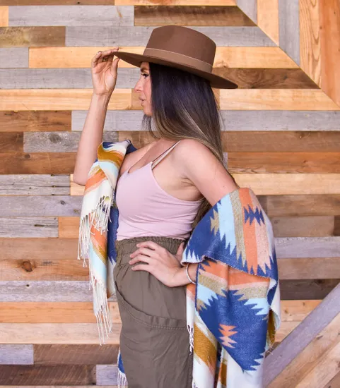 woman in hat standing in profile