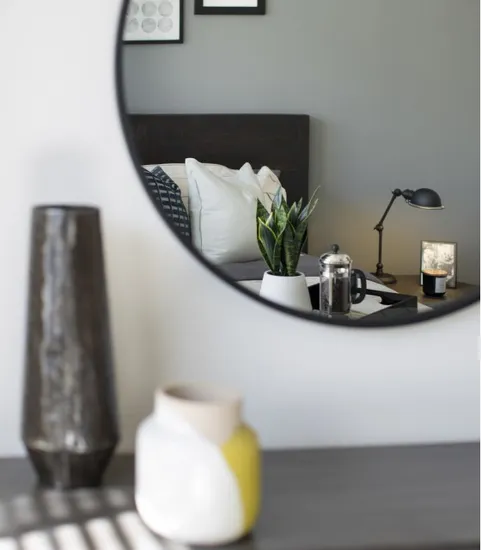 reflection in mirror in furnished bedroom
