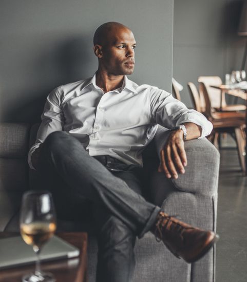 man sitting in armchair