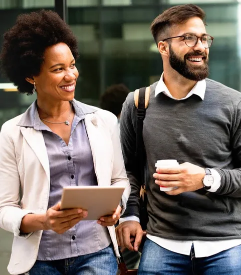 professional girl and guy holding coffee and ipad