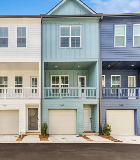 exterior townhomes with garages in daytime