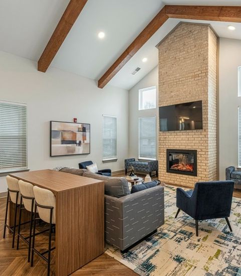 rendering of furnished clubroom with table and seating