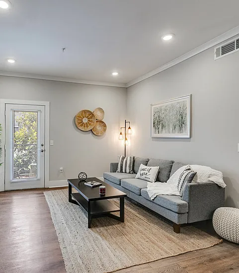 Living room with private balcony at Paragon Luxury Apartments in Athens, GA