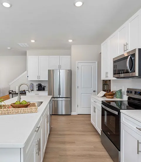 Kitchen with white cabinets and stainless steel appliances