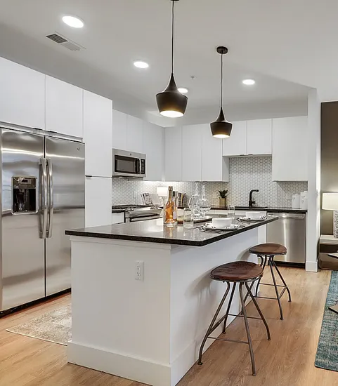 Kitchen with large island and white cabinets