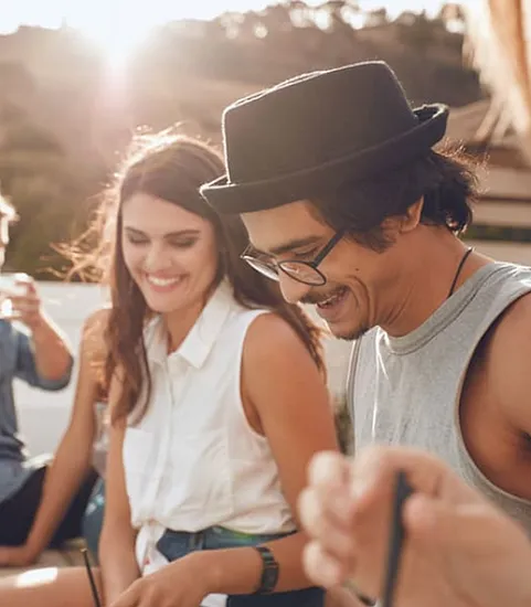 woman and man outdoors smiling
