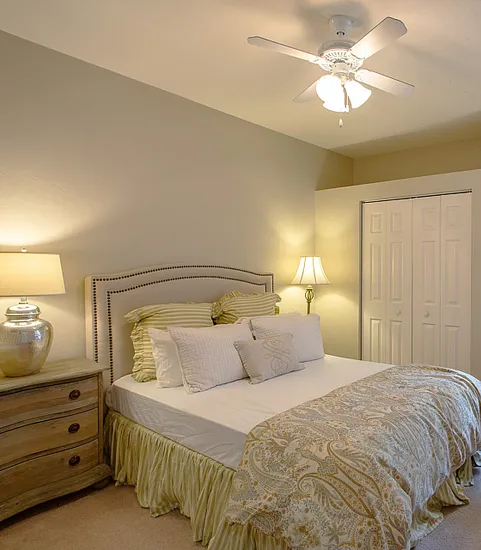 Bedroom with large bed and desk