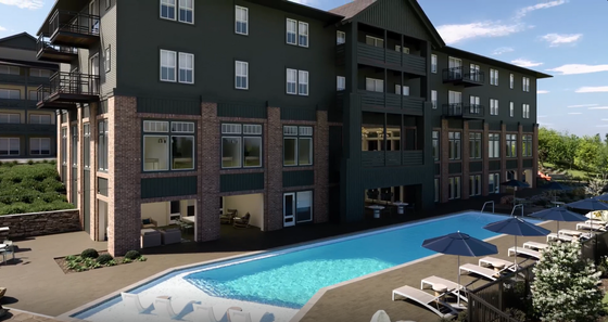 Elegant apartment building with modern design, featuring a sparkling pool and relaxing lounge area.
