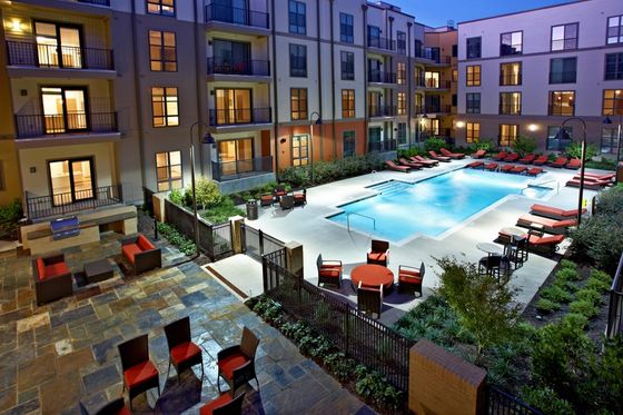 Photograph showcasing the pool and courtyard area.