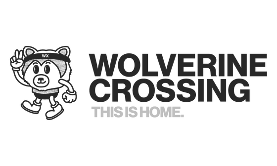 Charming cartoon mascot of Wolverine Crossing beside the bold text 'This is Home.'