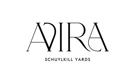 Elegant AVIRA Schuylkill Yards logo featuring sophisticated typography.