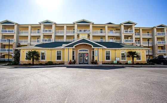 Front office entrance with apartment building behind.