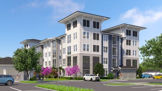 Modern four-story apartment complex with sleek design, lush landscaping, and ample parking in a serene residential area.