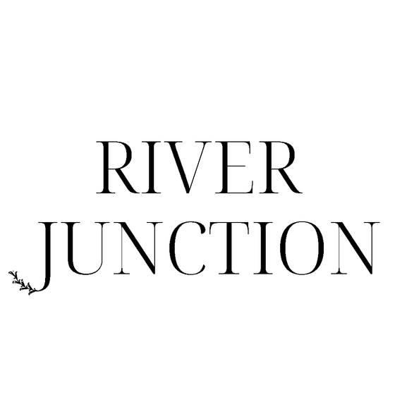 Elegant River Junction logo with a stylish floral accent, conveying modern sophistication.