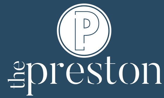 Elegant logo of 'The Preston' with a sophisticated monogram 'P' on a deep blue background.