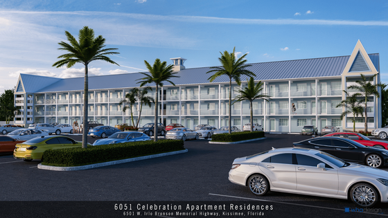 Modern three-story apartment complex with ample parking and tropical landscaping under a clear blue sky.