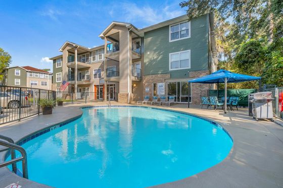 Pool with apartments in background