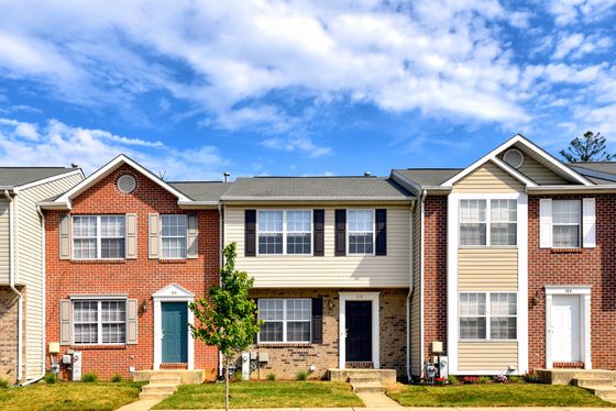 view of three greenway village townhomes from street