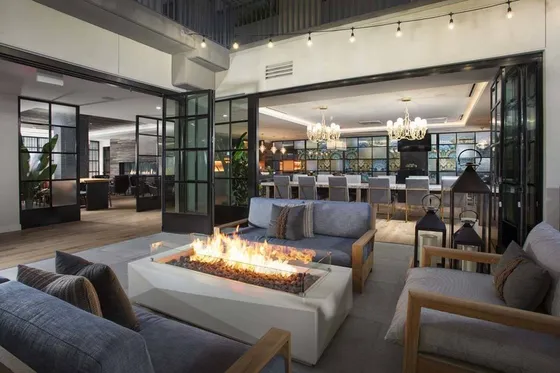 Firepit area indoors in gathering space and clubroom