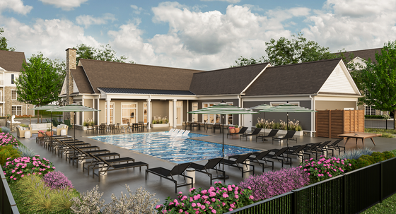 Luxurious outdoor pool area with stylish loungers and vibrant gardens, perfect for relaxing and entertaining.