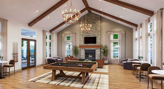 Elegant living space with vaulted ceilings, stone fireplace, and grand chandeliers, featuring a billiards table and cozy seating areas for a luxurious ambiance.