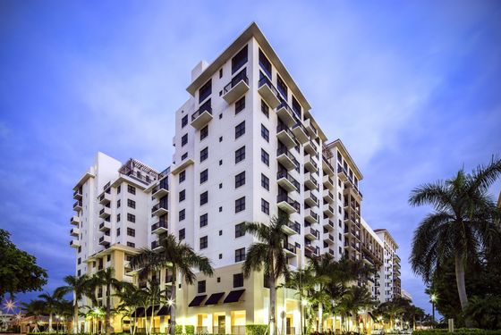 The Mark at Cityscape, exterior, tall white building, balconies, palm trees