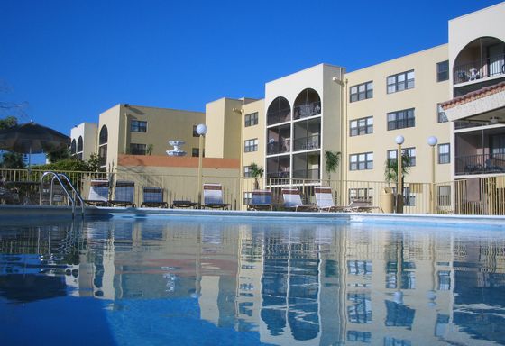 Royalton on The Green Exterior | View of the building from pool