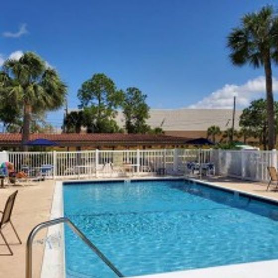 Cypress Place Apartments, exterior, sparkling blue swimming pool, trees