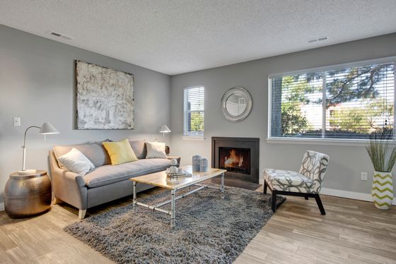 Elegant Living Area with Fireplace | Apartments Near Aurora CO | The Grove at City Center Apartments
