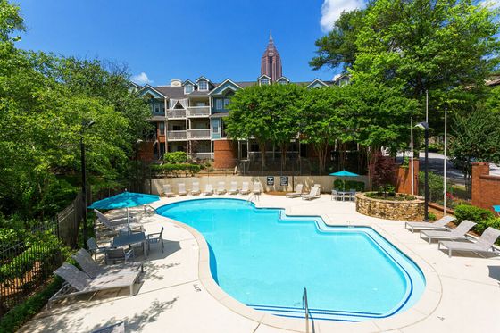 Swimming pool with lounge chairs at Muse ATL boutique apartments in Atlanta