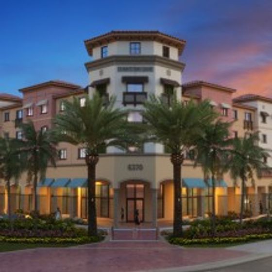 University Pointe, exterior, night, palm trees, 3 level building, street, main entrance,