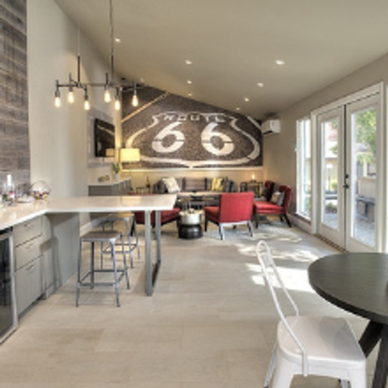 Resident Lounge with a large Route 66 sign over wall to wall seating area.