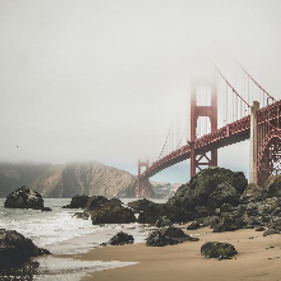 Foggy skies above the Famous Golden Gate Bridge spanning the bay.
