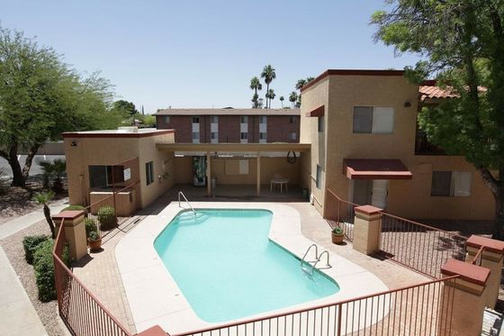 view of pool area. pool is fenced in around office building