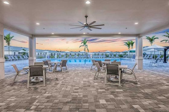 Computer rendering of pool with pool chairs and patio seating.