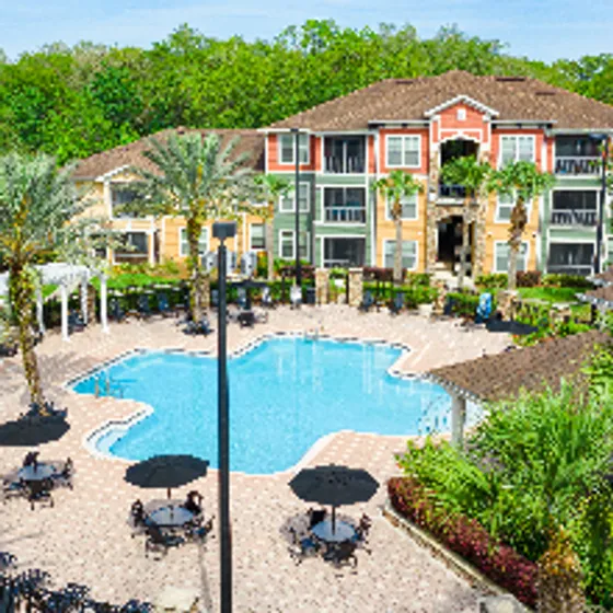 Oakleaf Village Apartments, exterior, red, orange, green exterior, three levels, trees