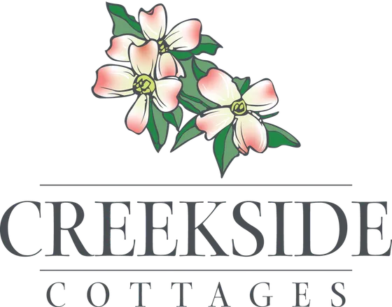 Elegant logo for Creekside Cottages featuring beautifully illustrated blooming flowers, reflecting serene and charming living spaces.