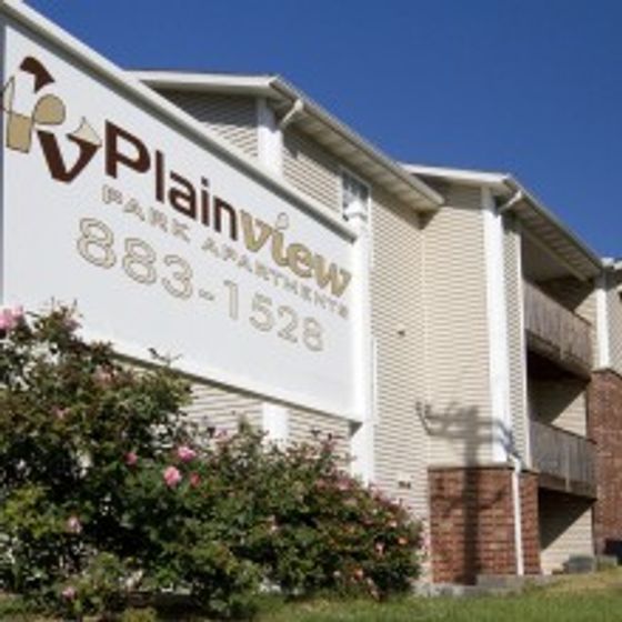 Plainview Park Apartments sign and exterior of building