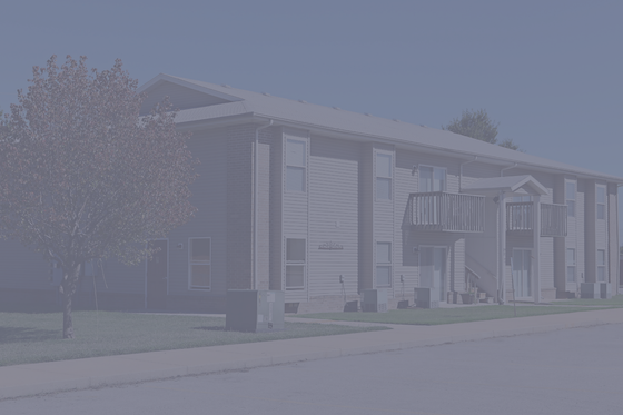 Charming residential building with spacious balconies, lush greenery, and inviting modern architecture.
