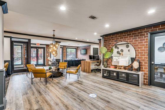 Leasing office with hardwood floors and sitting area