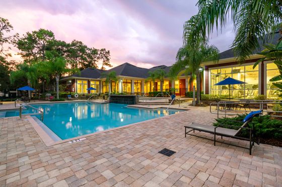 Sunset view of pool and fitness center