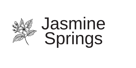 Elegant Jasmine Springs logo featuring a detailed black and white jasmine flower illustration.