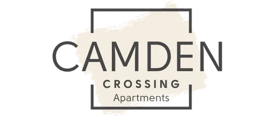 Elegant logo design for Camden Crossing Apartments showcasing modern typography and a stylish paintbrush backdrop.